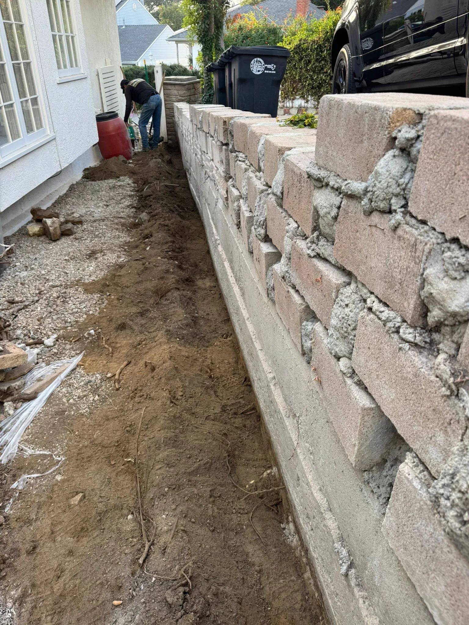 Block wall mid-construction with fresh mortar joints