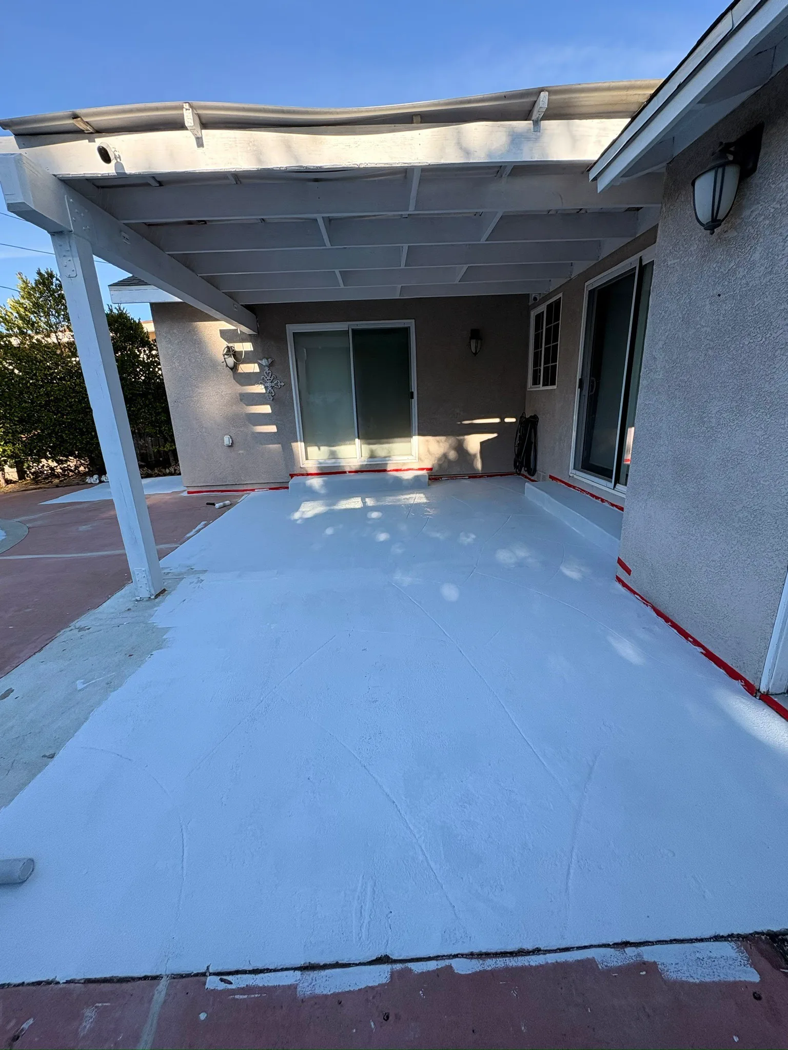 New concrete patio slab poured under a covered patio at a Los Angeles home